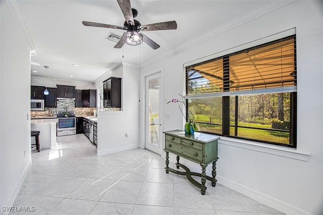 interior space with ceiling fan, light tile patterned floors, and crown molding