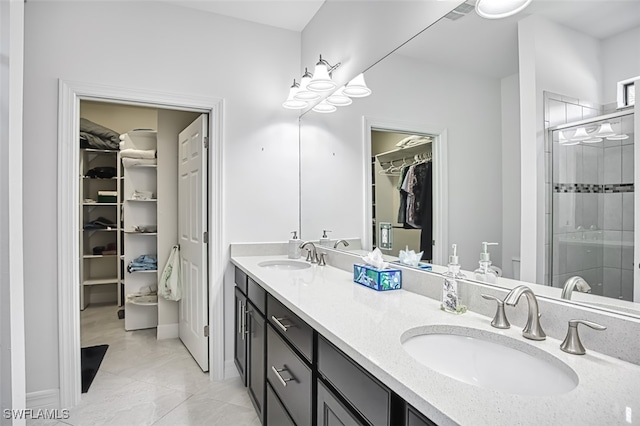 bathroom featuring vanity and a shower with shower door