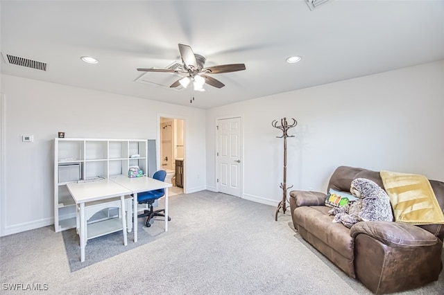 carpeted office with ceiling fan