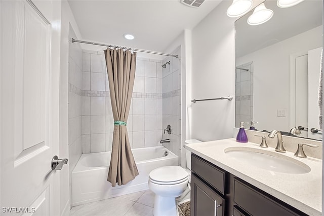 full bathroom with toilet, shower / bath combo, vanity, and tile patterned floors