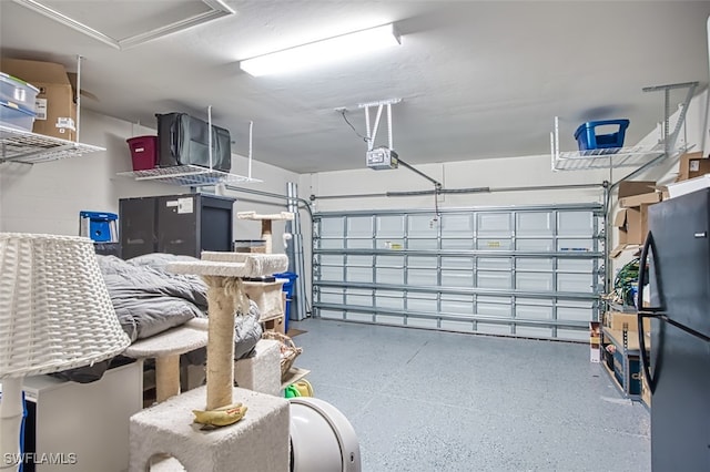 garage featuring a garage door opener and fridge