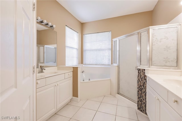 bathroom with independent shower and bath, vanity, and tile patterned flooring