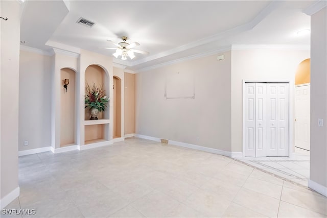 spare room featuring ceiling fan and ornamental molding