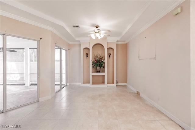 empty room featuring ceiling fan, light tile patterned flooring, and ornamental molding