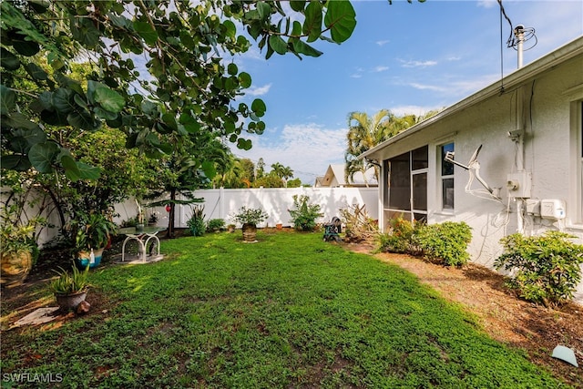 view of yard with a sunroom