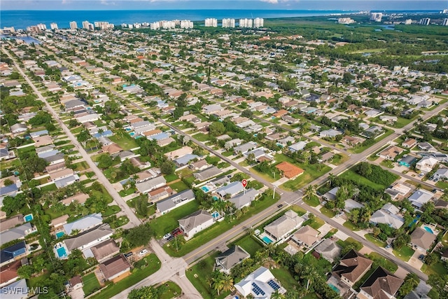 drone / aerial view with a water view