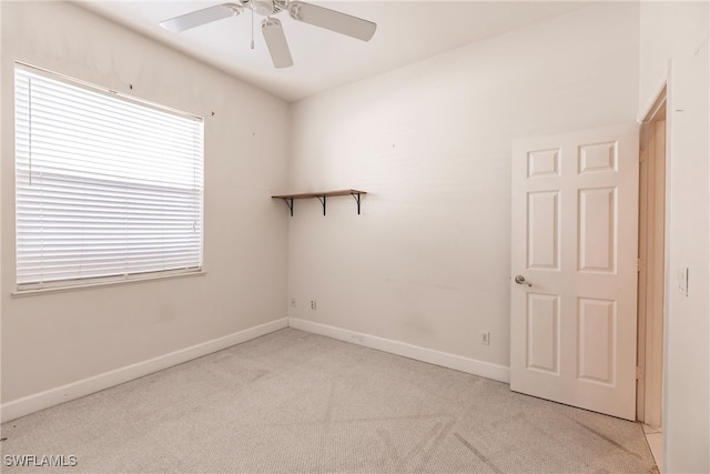 empty room with light carpet and ceiling fan