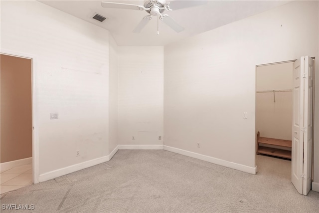 carpeted empty room with ceiling fan