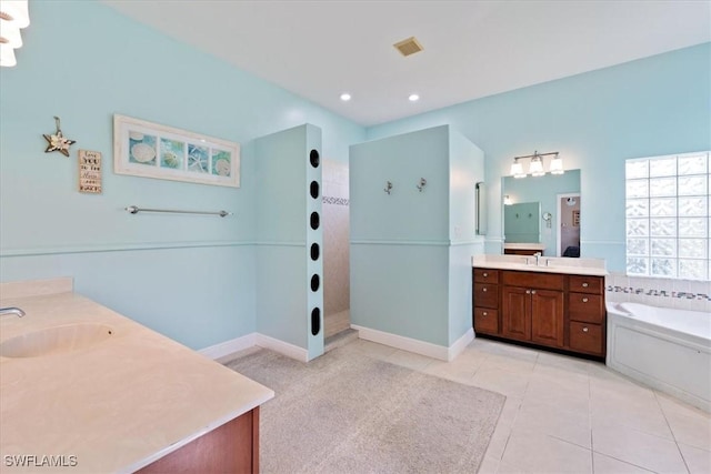 bathroom featuring tile patterned flooring, vanity, and independent shower and bath