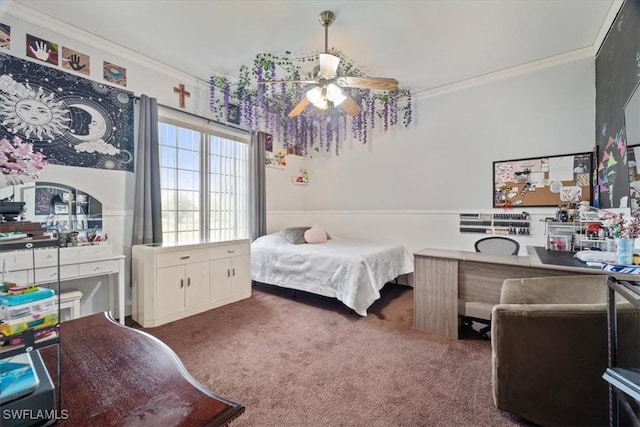 bedroom with ceiling fan, ornamental molding, and carpet