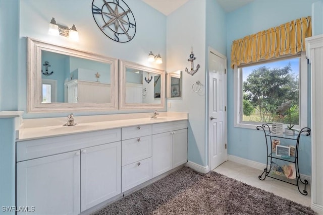 bathroom with vanity and tile patterned floors