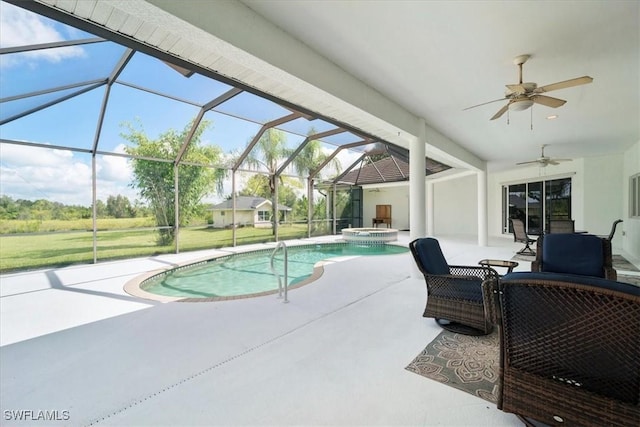 view of pool featuring an in ground hot tub, a lanai, ceiling fan, and a patio area