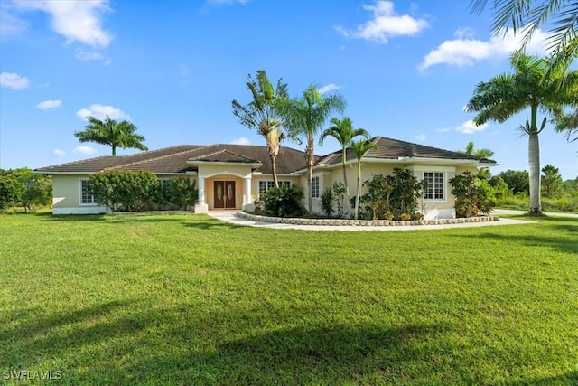 ranch-style home featuring a front yard