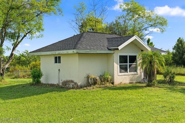 view of property exterior featuring a lawn