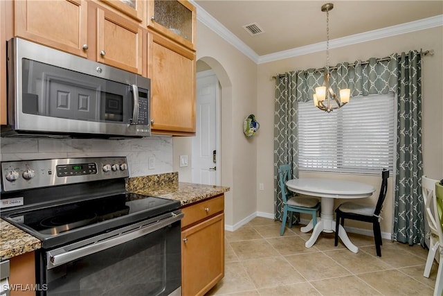 kitchen with backsplash, light stone counters, stainless steel appliances, a notable chandelier, and hanging light fixtures