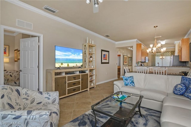 living room with light tile patterned flooring, crown molding, and an inviting chandelier