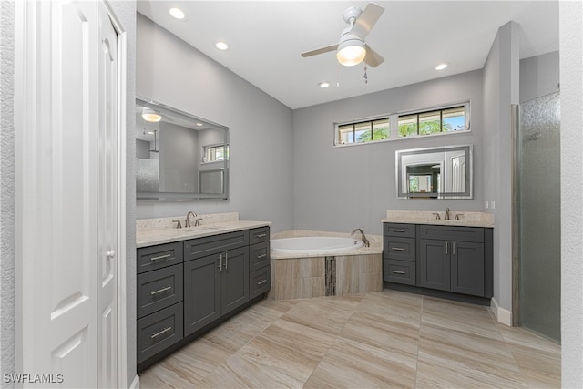 bathroom featuring ceiling fan, vanity, plus walk in shower, and tile patterned floors