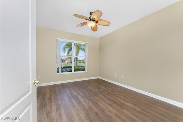 spare room featuring ceiling fan and dark hardwood / wood-style flooring