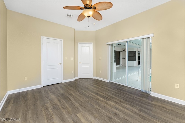 unfurnished bedroom with ceiling fan and dark hardwood / wood-style flooring