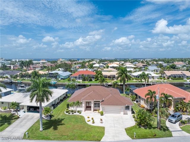 birds eye view of property featuring a water view