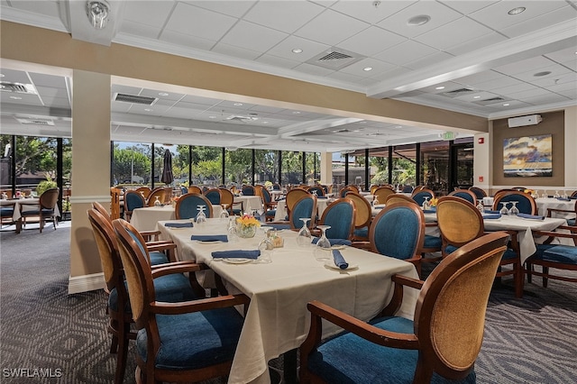 dining space featuring dark carpet and ornamental molding