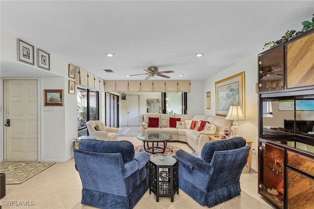 tiled living room featuring ceiling fan