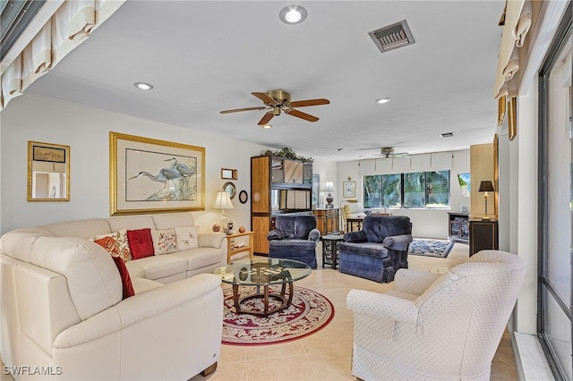 living room featuring light tile patterned flooring and ceiling fan