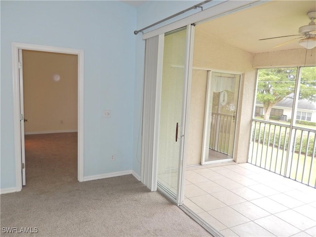 unfurnished sunroom with ceiling fan