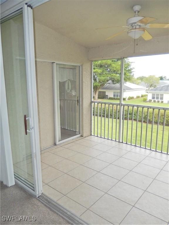 14521 Daffodil Dr Unit 1508, Fort Myers, FL 33919 - unfurnished sunroom featuring a ceiling fan