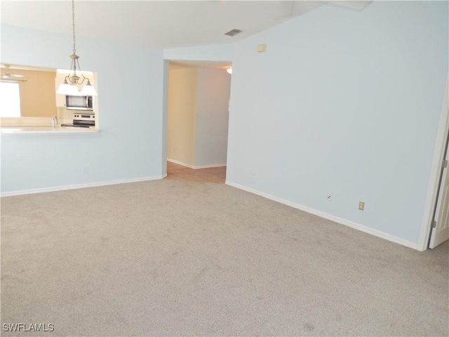 unfurnished living room with light carpet