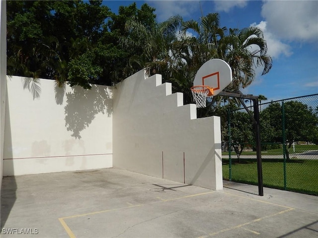 view of sport court featuring community basketball court and fence