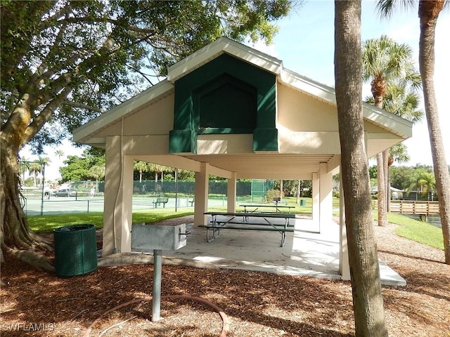 view of property's community featuring fence