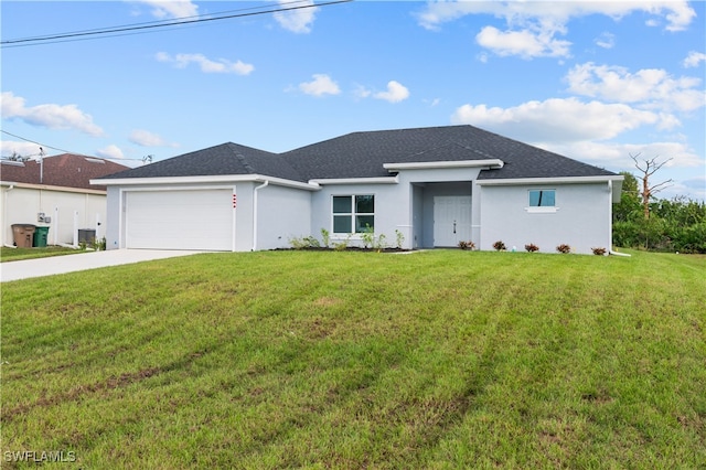 view of front of house with a garage and a front yard