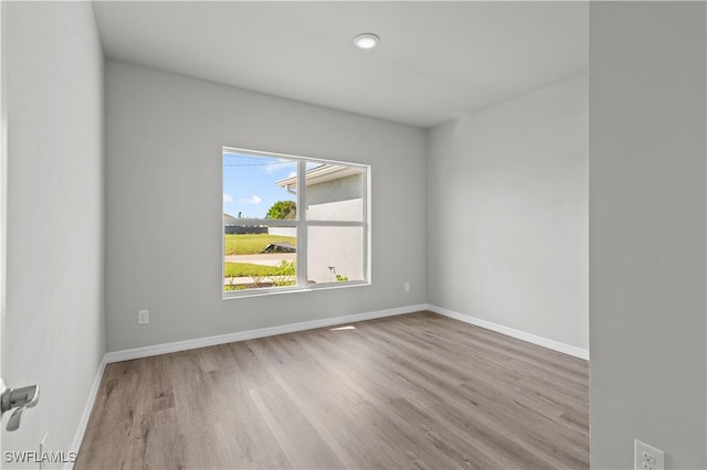 spare room featuring light wood-type flooring