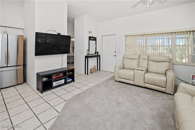 tiled living room featuring ceiling fan