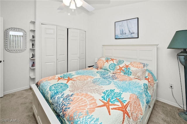 carpeted bedroom featuring ceiling fan and a closet