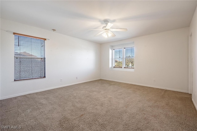 unfurnished room featuring carpet and ceiling fan