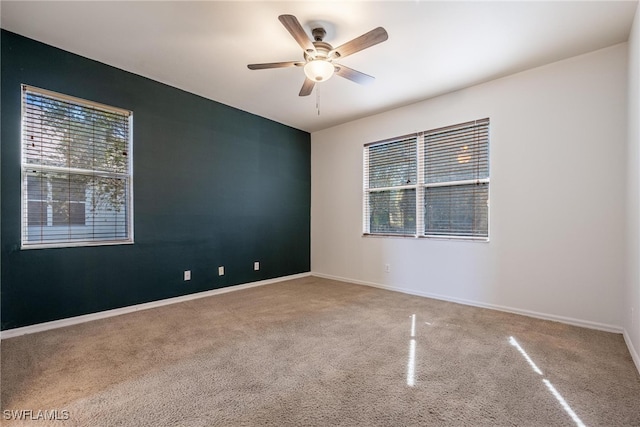 unfurnished room featuring ceiling fan