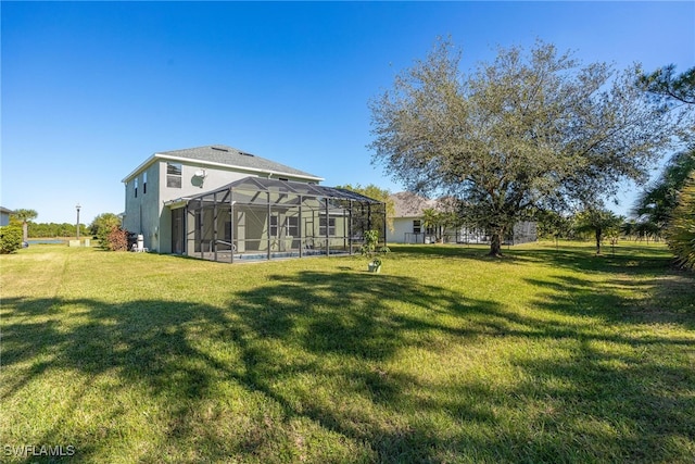 view of yard with glass enclosure