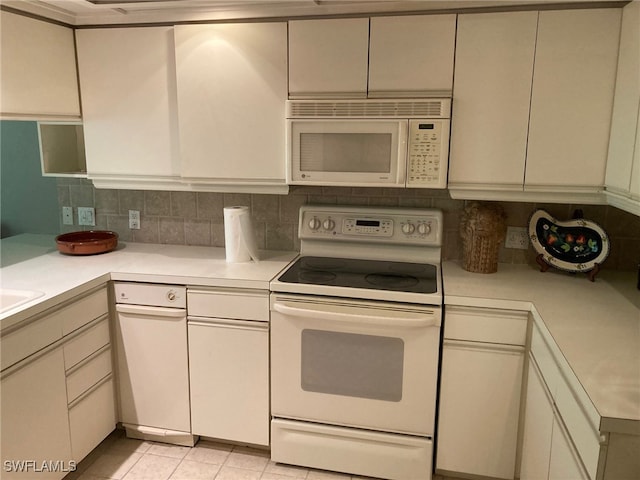 kitchen with white appliances, decorative backsplash, and light tile patterned flooring