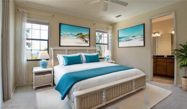 carpeted bedroom featuring ceiling fan and crown molding