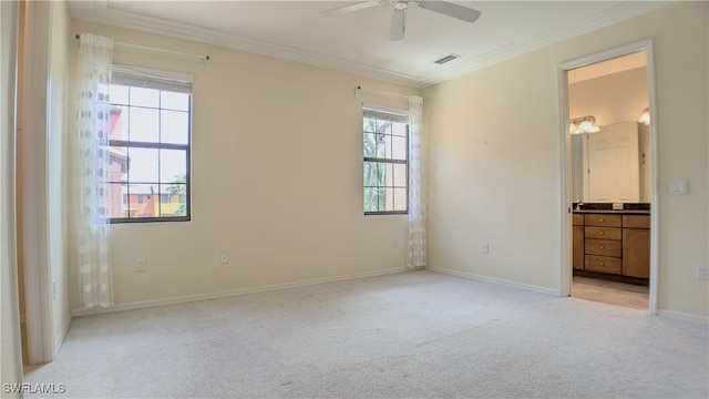 unfurnished bedroom featuring light carpet, connected bathroom, and crown molding