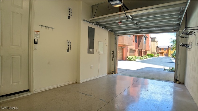 garage featuring a garage door opener and electric panel