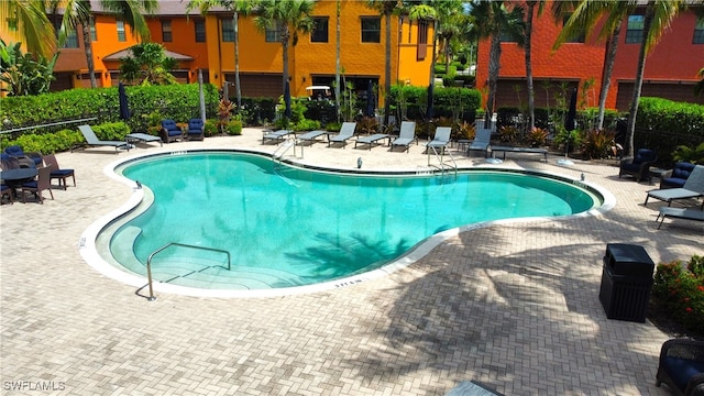 view of swimming pool featuring a patio area