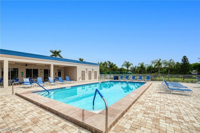 view of pool with ceiling fan and a patio area