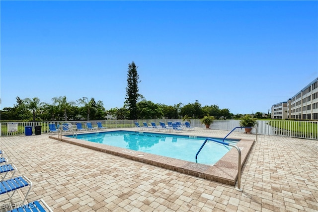 view of swimming pool with a patio area