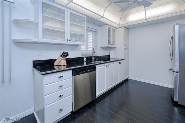 kitchen featuring ceiling fan, white cabinets, sink, dark wood-type flooring, and appliances with stainless steel finishes