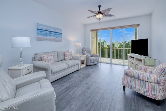 living room with wood-type flooring and ceiling fan