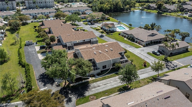 aerial view featuring a residential view and a water view