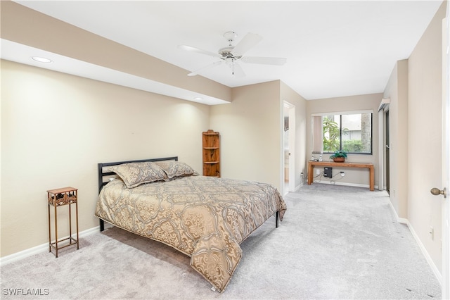 bedroom featuring ceiling fan and light colored carpet